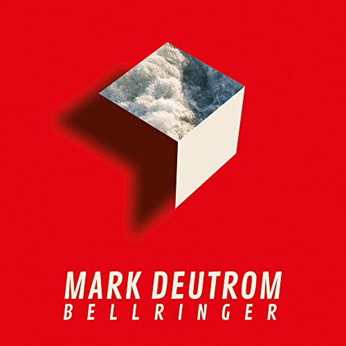 Red album cover with a white cube displaying stormy ocean waves.