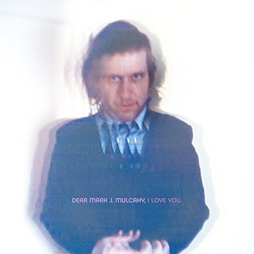 Blurred portrait of Mark Mulcahy in a suit with album title text.
