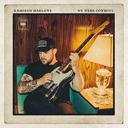 Album cover for Kameron Marlowe’s “We Were Cowboys” featuring a man with a guitar.