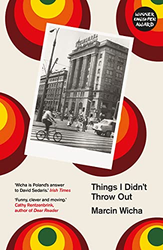 Book cover with a black and white street scene photo and colorful circular patterns.