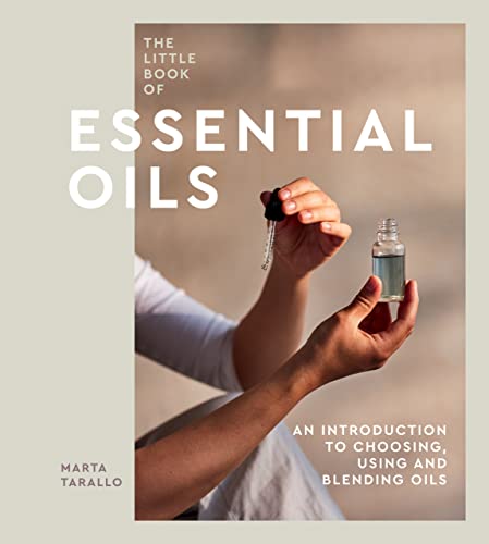 Book cover showing a person holding a small glass bottle of essential oil.