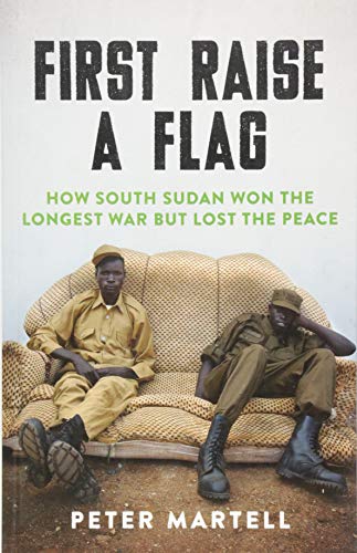 Book cover: "First Raise a Flag" with two soldiers on a sofa.