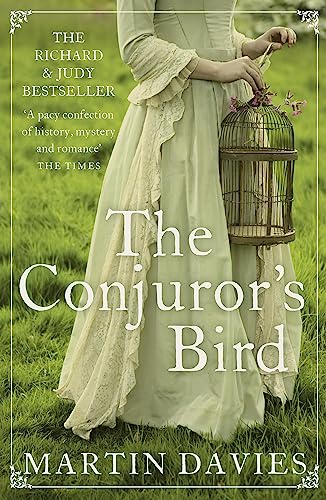 Book cover: woman in gown holding a birdcage in a field.