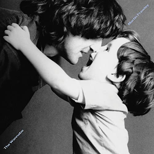 Black and white photo of a man and a child touching noses.