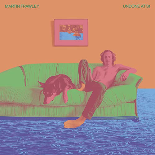 Album cover: man and dog lounging on a green couch, orange wall.