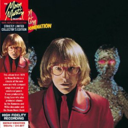 A man with glasses and a red jacket stands before two shimmering, faceless figures.