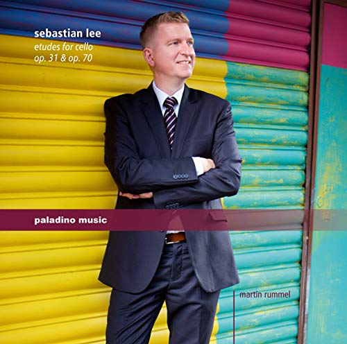 CD cover: Man in suit stands before a yellow corrugated door.