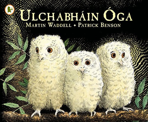 Book cover with three fluffy white owlets against a dark background.