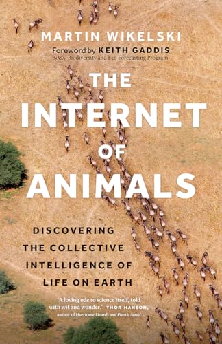 Book cover showing an aerial view of a wildebeest herd on dry savanna grass.