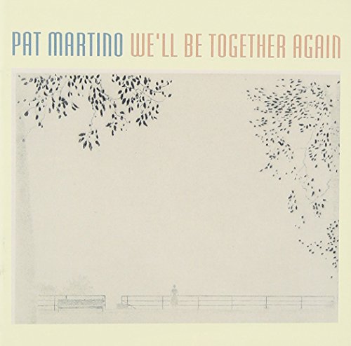 CD cover with blue text, tree branches, and a distant figure.
