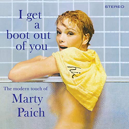 Album cover with woman in shower, wrapped in yellow towel, blue tile background.