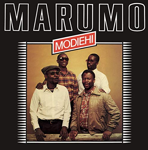 "Vinyl album cover with 'MARUMO' title and group photo of four men."