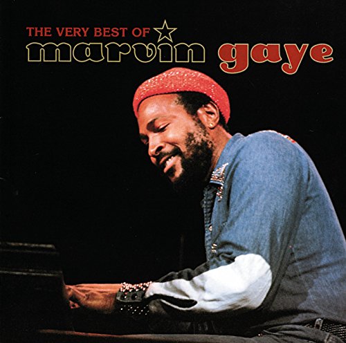 Marvin Gaye sitting at a piano wearing a red headband and denim shirt.