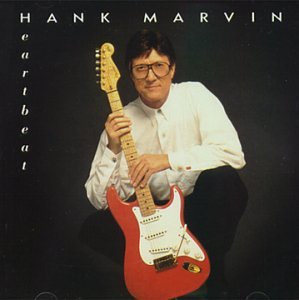 Hank Marvin with a red electric guitar, album cover image.