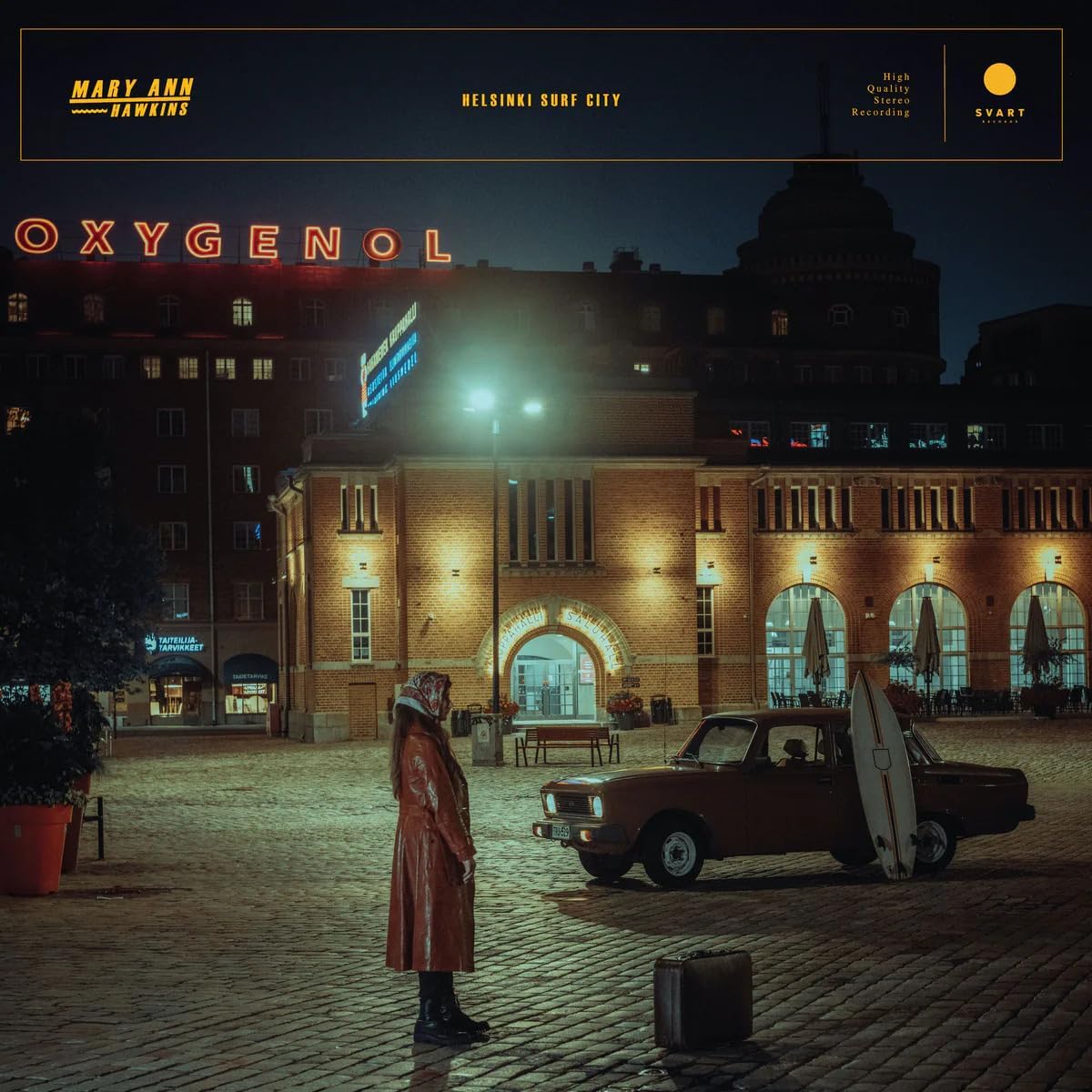 Vinyl record cover: city street scene with a car and surfboard.