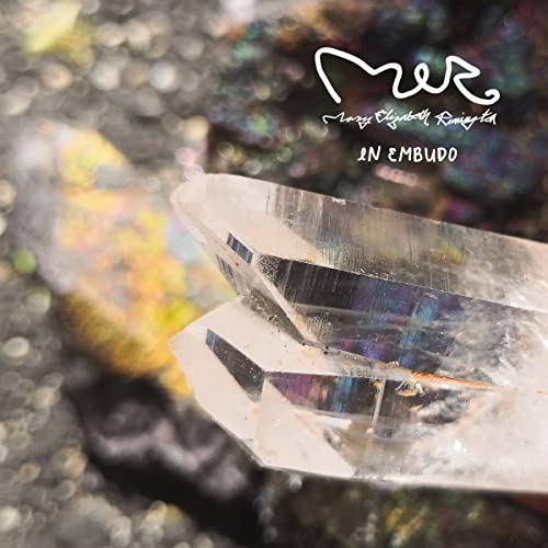 Close-up of clear quartz crystals with text overlay reading Mary Elizabeth Remington In Embudo.