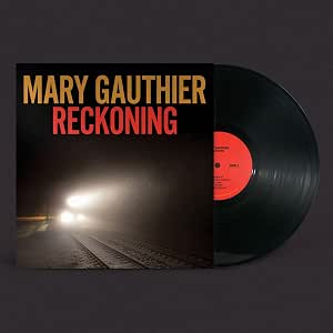 Mary Gauthier’s “Reckoning” vinyl record with a train track and headlight image.