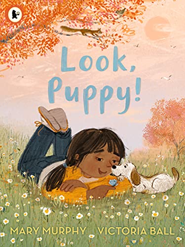 Child lying in grass with a puppy, illustrated book cover.