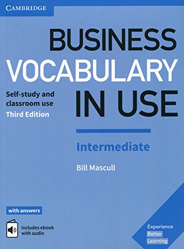 "Light blue textbook cover with 'Business Vocabulary in Use' title and 'Cambridge' logo."