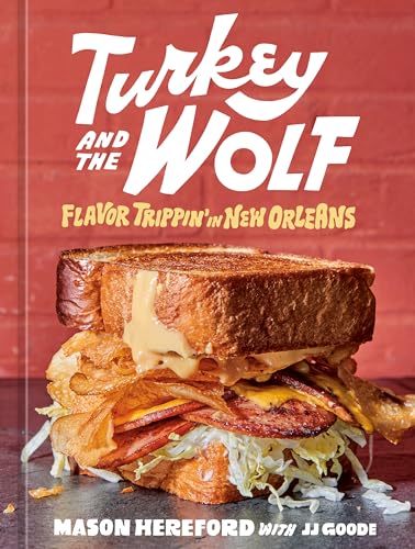 A cookbook cover featuring a toasted sandwich against a red brick background.