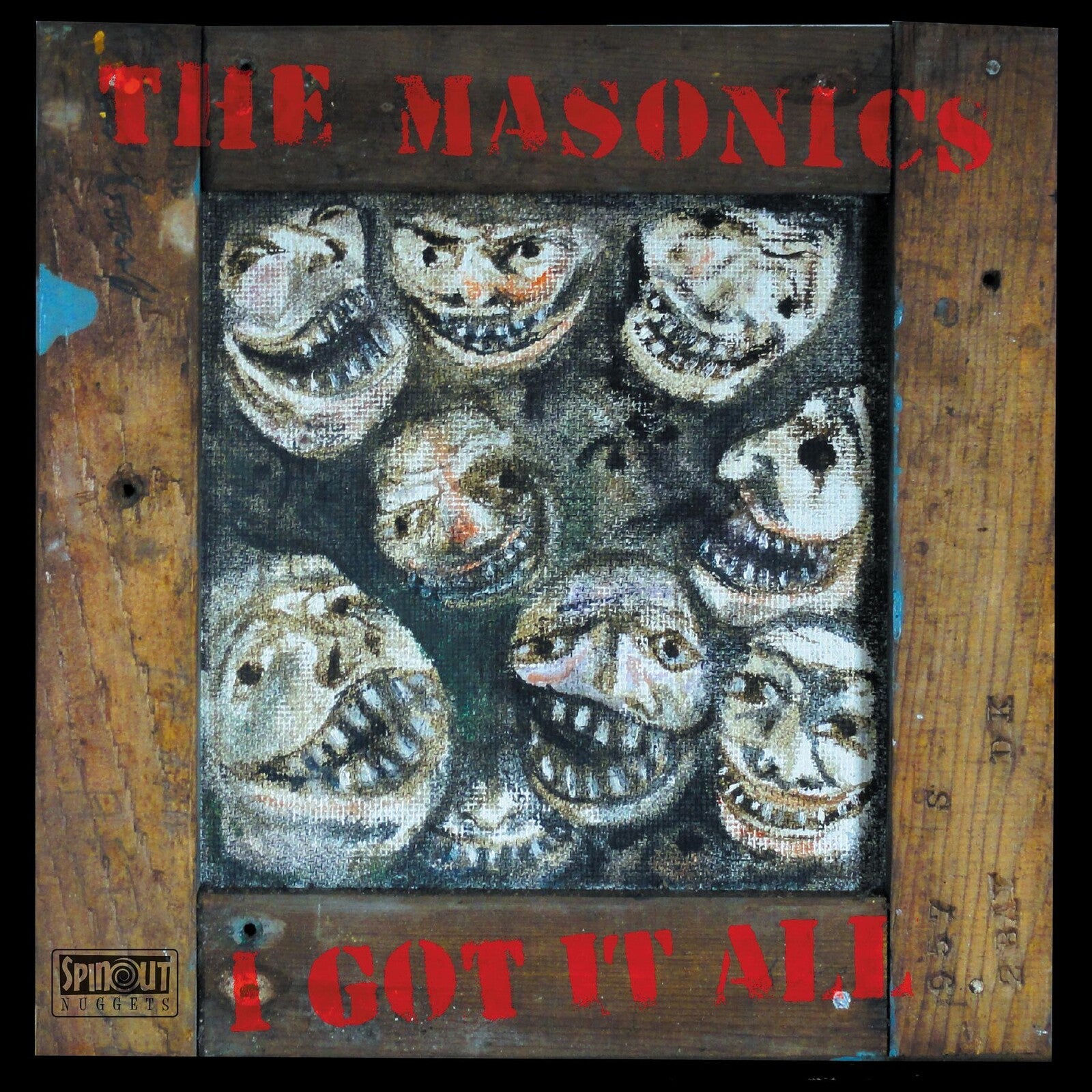 Vinyl record cover with painted, distorted faces in a wooden frame.