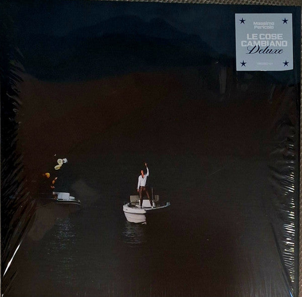 Vinyl record cover: dark water scene with a figure on a boat.