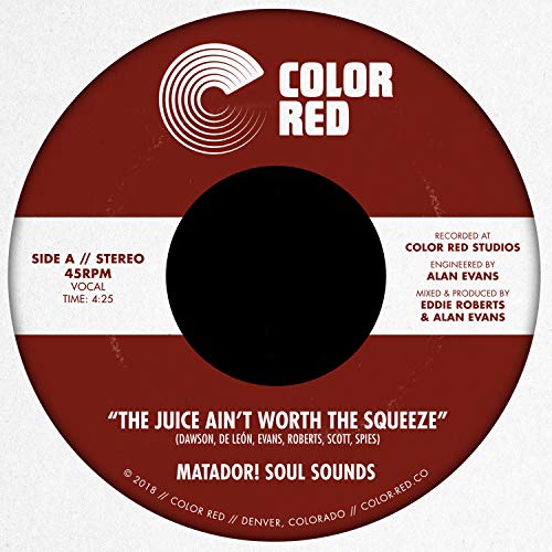 Red vinyl record label with white text and a spiral design.
