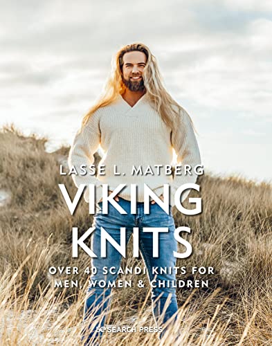 Book cover featuring a long-haired man in a cream sweater standing in tall grass.