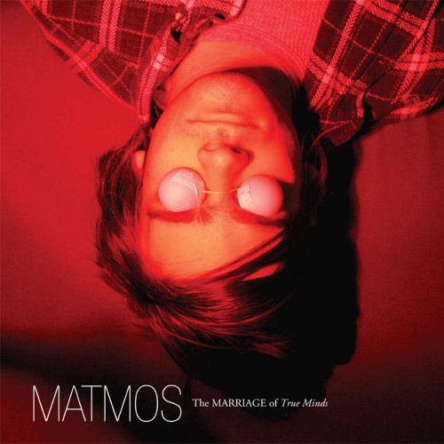 Red album cover featuring a person with headphones, face-up view.
