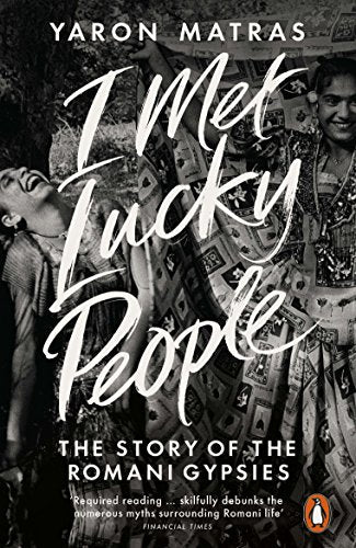 Book cover: "I Met Lucky People" featuring portraits and patterned fabric.