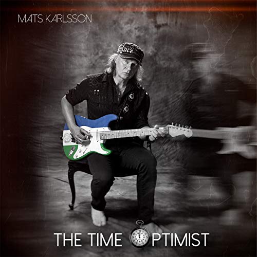 Album cover featuring a man playing a multicolored electric guitar, with motion blur.