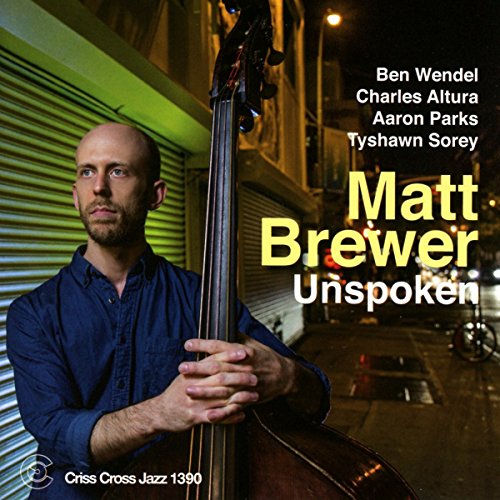 "Album cover featuring a man holding a double bass, with text overlay."