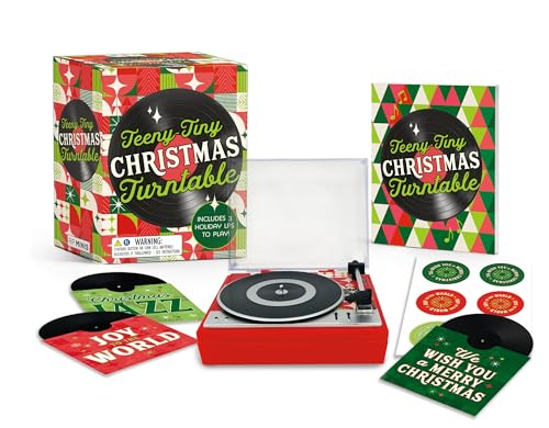 Red miniature record player with three small Christmas vinyl records and box.
