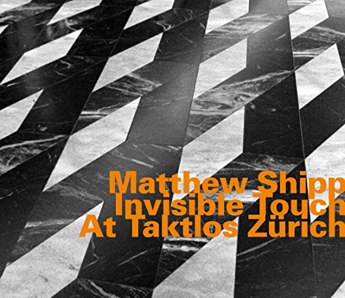 "CD cover with black and white marble pattern and orange text."