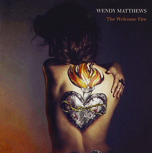 Wendy Matthews The Welcome Fire CD cover showing a woman with a heart tattoo.