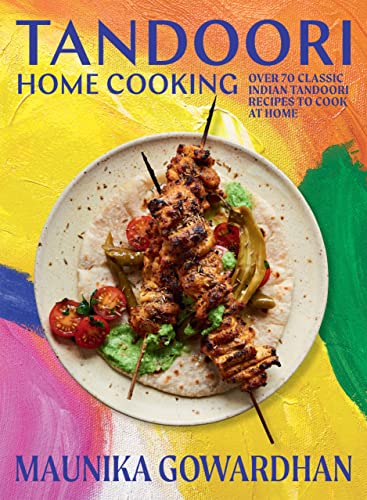 Cookbook cover featuring tandoori chicken skewers on a colorful, painted background.