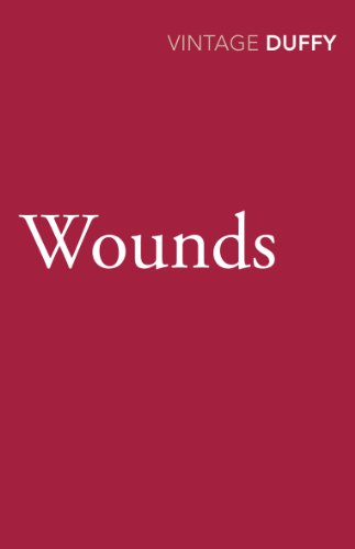 Book cover: “Wounds” by Carol Ann Duffy, with white text on red.