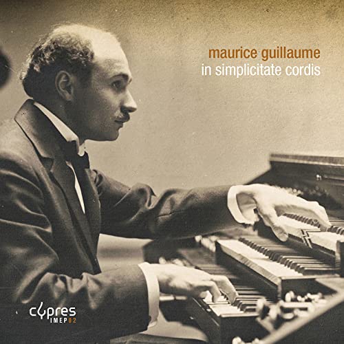 Sepia-toned portrait of pianist Maurice Guillaume at a piano.
