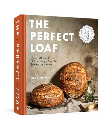 Hardcover book titled The Perfect Loaf featuring two sourdough loaves on a cooling rack.