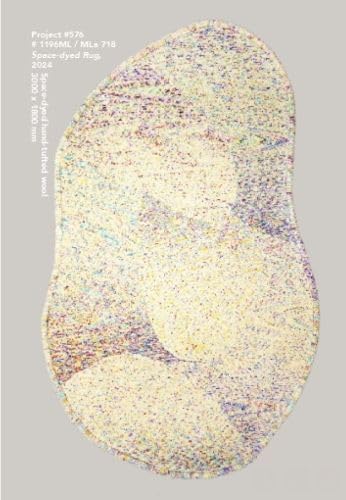 Irregularly shaped, textured rug with overlapping pale circles and colorful flecks.