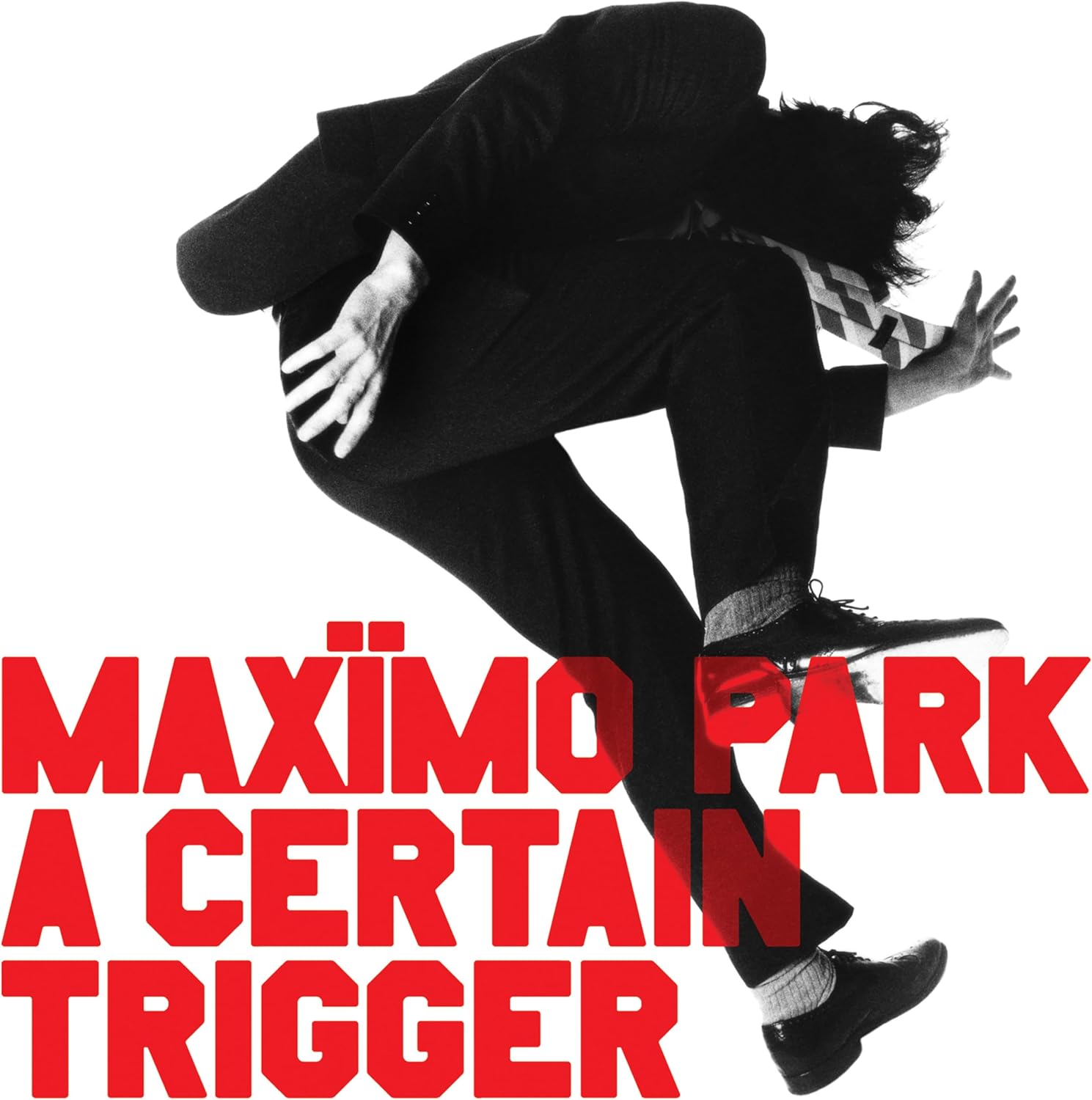 Maxïmo Park album cover: a jumping figure in black and red text.