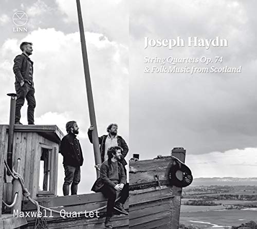 Black and white album cover featuring four men on a wooden dock outdoors.