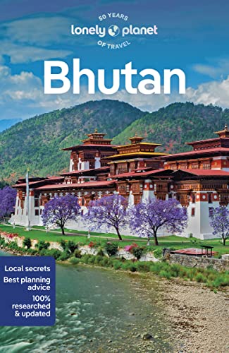 Lonely Planet Bhutan travel guide cover featuring a traditional monastery by a river.