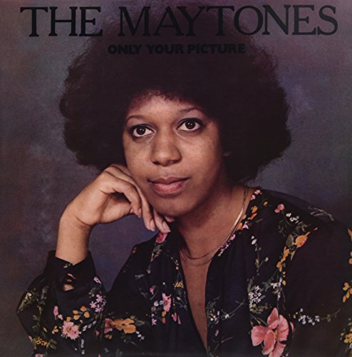Vinyl album cover featuring a woman with an afro and floral shirt.