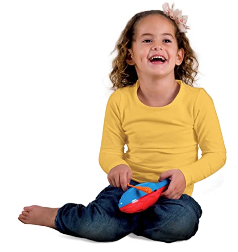 Girl with curly hair laughs while holding a blue and red toy.