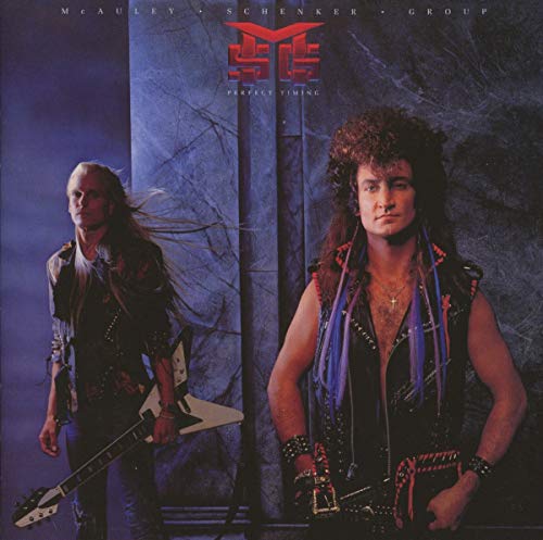 McAuley Schenker Group band members posing in front of a blue marble background.