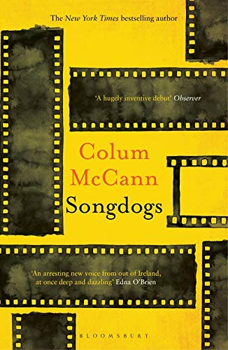 Yellow book cover with filmstrip borders and red text: "Songdogs" by Colum McCann.