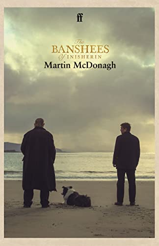 Two men and a dog stand on a beach facing the sea under cloudy skies.