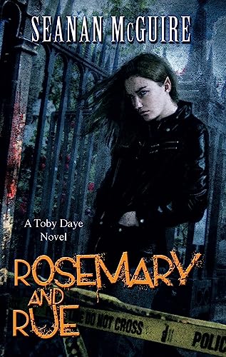 Book cover: woman with dark hair, black jacket, and wrought iron gate.