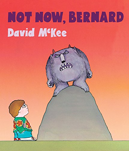 "Children's board book cover featuring a boy and a monster on a hill."